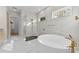 Modern bathroom with freestanding tub and walk-in shower at 3045 Dominion Ct, Safety Harbor, FL 34695