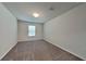 Bright and spacious bedroom with carpeted floor and large window at 31424 Amberview Bend, Wesley Chapel, FL 33545