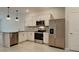 Modern kitchen featuring stainless steel appliances and granite countertops at 31424 Amberview Bend, Wesley Chapel, FL 33545