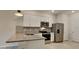 Modern kitchen with stainless steel appliances and granite countertops at 31424 Amberview Bend, Wesley Chapel, FL 33545