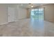 Bright living room with tile floors and sliding glass doors at 31424 Amberview Bend, Wesley Chapel, FL 33545