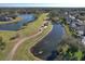 Aerial view of golf course and surrounding neighborhood at 3320 Stonebridge Trl, Valrico, FL 33596