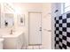 Bathroom features a vanity, a door and a black and white shower at 3391 Knox Ter, Port Charlotte, FL 33948