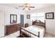 Bright bedroom with wood furniture and access to a closet at 3391 Knox Ter, Port Charlotte, FL 33948