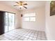Bright bedroom with tiled floors and access to a patio at 3391 Knox Ter, Port Charlotte, FL 33948