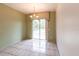 Simple dining room with tile floors and sliding glass doors at 3391 Knox Ter, Port Charlotte, FL 33948