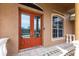 Close-up of the double front doors, featuring a rich, reddish-brown finish at 3391 Knox Ter, Port Charlotte, FL 33948