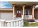 Elegant entryway with double doors, a tiled porch, and ornate columns at 3391 Knox Ter, Port Charlotte, FL 33948