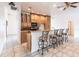 Kitchen boasts granite countertops, light wood cabinets, and a breakfast bar at 3391 Knox Ter, Port Charlotte, FL 33948
