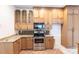 Kitchen features granite countertops and ample wood cabinets at 3391 Knox Ter, Port Charlotte, FL 33948