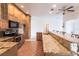 View of kitchen with granite countertops and stainless steel appliances at 3391 Knox Ter, Port Charlotte, FL 33948