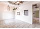 Living room featuring tile floors, neutral walls, and access to other rooms at 3391 Knox Ter, Port Charlotte, FL 33948