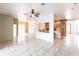 Open living space with a view of the kitchen and access to other areas of the home at 3391 Knox Ter, Port Charlotte, FL 33948