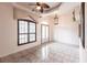 Large living room with tile floors, a ceiling fan, and plenty of natural light at 3391 Knox Ter, Port Charlotte, FL 33948