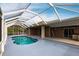 Inviting kidney-shaped pool with screened enclosure at 3391 Knox Ter, Port Charlotte, FL 33948