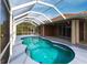 Relaxing kidney-shaped pool, screened patio at 3391 Knox Ter, Port Charlotte, FL 33948