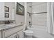 Bathroom with tub, toilet and granite vanity at 3404 Forsythia Dr, Odessa, FL 33556