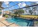 Screened pool and spa overlooking lake at 3404 Forsythia Dr, Odessa, FL 33556