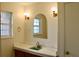Bathroom vanity with a green sink and marble countertop at 36847 Jefferson Ave, Dade City, FL 33523
