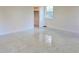 Bedroom with closet and window, terrazzo floors at 36847 Jefferson Ave, Dade City, FL 33523
