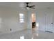 Bedroom with ensuite bathroom and terrazzo floor at 36847 Jefferson Ave, Dade City, FL 33523