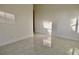 Spacious bedroom with large windows and terrazzo floor at 36847 Jefferson Ave, Dade City, FL 33523