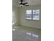 Bright bedroom with ceiling fan and terrazzo flooring at 36847 Jefferson Ave, Dade City, FL 33523