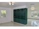 Dark green built-in shelving unit with glass shelves at 36847 Jefferson Ave, Dade City, FL 33523