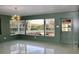 Spacious dining area with backyard views, and a door leading to the outside at 36847 Jefferson Ave, Dade City, FL 33523