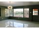 Bright dining room with large windows and a view of the backyard at 36847 Jefferson Ave, Dade City, FL 33523