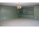 Dining room with built-in shelving and a modern chandelier at 36847 Jefferson Ave, Dade City, FL 33523