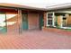 Brick patio with planters and green doors at 36847 Jefferson Ave, Dade City, FL 33523