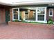 Brick home with hexagonal patio and green door at 36847 Jefferson Ave, Dade City, FL 33523