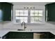 Updated kitchen features white quartz countertops and a gold faucet at 36847 Jefferson Ave, Dade City, FL 33523