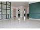 Open living area with terrazzo floor and green accents at 36847 Jefferson Ave, Dade City, FL 33523