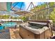 Relax in this covered hot tub with views of the pool at 3800 40Th S St, St Petersburg, FL 33711