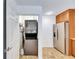 Stackable washer and dryer in a well-lit laundry room at 4128 Pinelake Ln # 101, Tampa, FL 33618