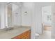 Bathroom featuring a vanity and mirror, with a view into a spacious bedroom at 4407 W Dale Ave, Tampa, FL 33609
