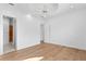 Spacious bedroom featuring a tray ceiling, hardwood floors and neutral walls at 4407 W Dale Ave, Tampa, FL 33609
