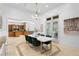 Bright dining area with marble table, chandelier, and an open layout at 4407 W Dale Ave, Tampa, FL 33609