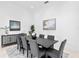 Formal dining room with gray chairs and modern decor at 4407 W Dale Ave, Tampa, FL 33609