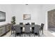 Formal dining room with gray chairs and modern decor at 4407 W Dale Ave, Tampa, FL 33609