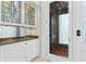 Interior view of elevator nestled between elegant mirrored bar area at 4407 W Dale Ave, Tampa, FL 33609