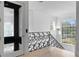 Bright foyer features a glass door, ornate black iron railing and travertine floors at 4407 W Dale Ave, Tampa, FL 33609