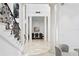 Grand foyer with decorative pillars and staircase at 4407 W Dale Ave, Tampa, FL 33609