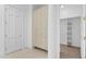 Hallway with storage and access to a walk-in closet, offering ample storage solutions at 4407 W Dale Ave, Tampa, FL 33609