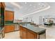 Gourmet kitchen with a natural stone island, custom cabinets, and stainless steel appliances at 4407 W Dale Ave, Tampa, FL 33609