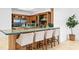 Well-appointed kitchen with bar stool seating and natural stone countertops at 4407 W Dale Ave, Tampa, FL 33609