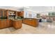 Beautiful kitchen with custom wood cabinetry, a center island, and open layout to living space at 4407 W Dale Ave, Tampa, FL 33609