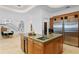 This kitchen features a central island with green countertops and built-in wine cooler, complemented by stainless steel appliances at 4407 W Dale Ave, Tampa, FL 33609